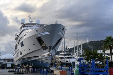 Luxury super yacht ashore on ship repairing yard. Yard period. Repairing. Motor yacht.