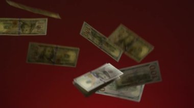 Falling money on red background. Raining money in one hundred dollar bill real slow motion footage