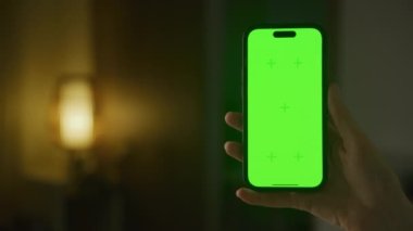 Vertical green screen smartphone with copy space. Modern phone mockup with chroma key