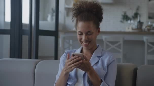 stock video Woman Laughing Using Smartphone, businesswoman smile in emotions - shot handheld in slow motion