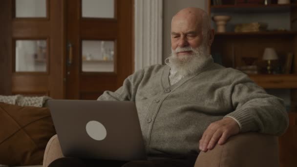 Grandfather Browsing Laptop Relaxing Watching Content Armchair — Stockvideo
