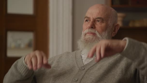 Pensive Senior Man Stretching Arms Armchair Close Mature Man Looking — Stock Video