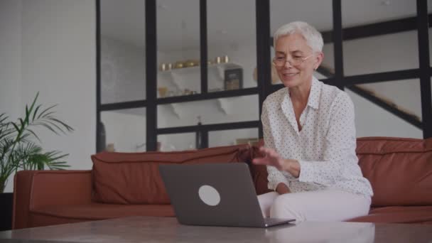 Modern Elderly Woman Speaking Video Call Using Laptop Computer — Stock Video