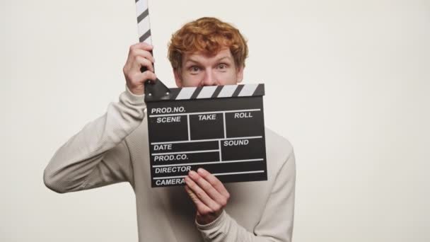 Ginger Man Clapping Clapperboard White Background — Stock Video