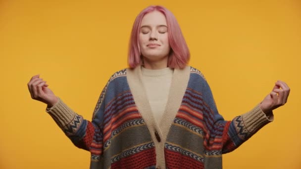 Serene Young Woman Pink Hair Meditating Outstretched Arms Yellow Background — Stock Video