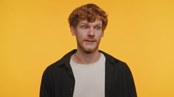 Young Man Curly Red Hair Showing Surprised Expression Covering His — Stock Video