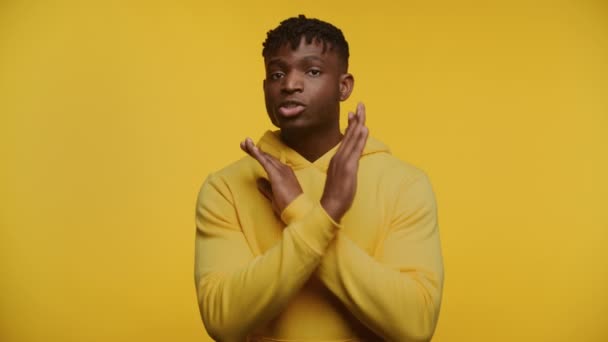 Man Yellow Turtleneck Making Cross Sign His Arms Signal Stop — Stock Video