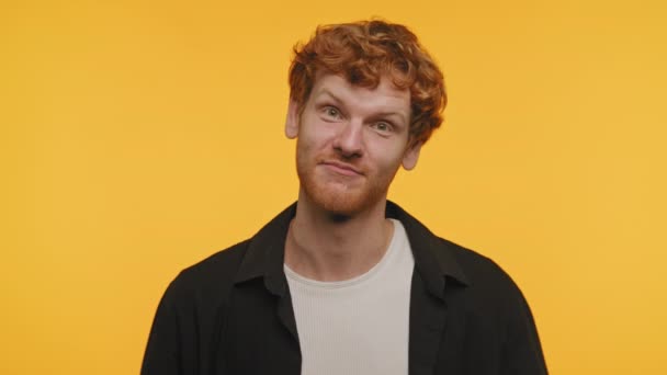 Young Man Ginger Hair Raising Eyebrows Bright Yellow Background — Stock Video