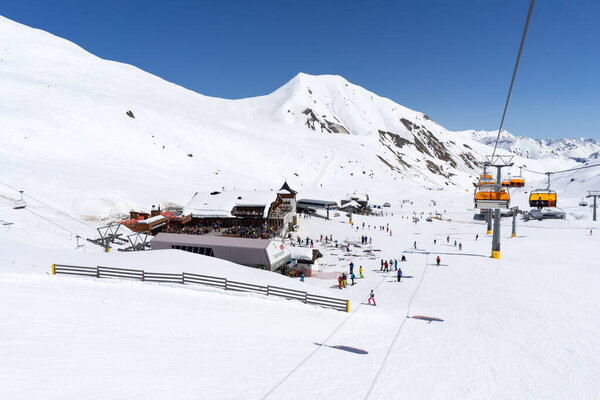 Breathtaking Alpine Ski Resort Experience with Snow Capped Mountains and Scenic Chairlift Adventure