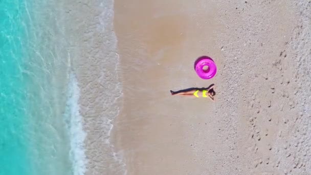 Aerial View Lying Beautiful Young Woman Pink Swim Ring Sandy — Stockvideo