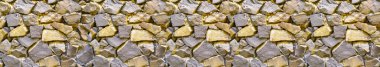 Close-up image of the wall. Rough, natural stone texture. Stone of different sizes and shapes. Template for interior design, websites or promotional materials. Banner for insertion into site.