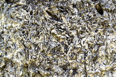 Image of stone texture with small cracks and inclusions. Rough, relief surface. Template for interior design, websites or promotional materials. Horizontal image.