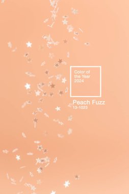 Peach Fuzz renginde kayan yıldız parıltısıyla soyut minimalist arkaplan - 2024 yılının rengi.