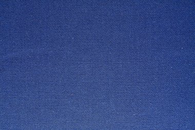 İnce parıltılı ve eşit aralıklı nokta dokusuna sahip kraliyet mavi kumaşı yakın plan, tasarım projeleri ve yaratıcı görseller için ideal..