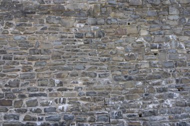 Antik taş duvarlardan yapılmış taş duvar, yakın plan. Duvar kağıdı kavramı