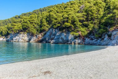 The famous turquoise pebble beach of Kastani where the famous Mamma Mia movie was filmed, located in Skopelos island, Sporades, Greece