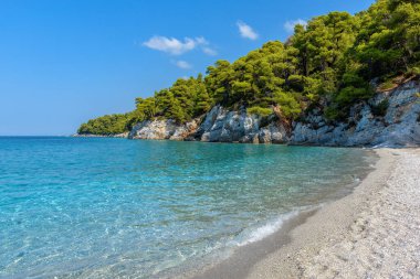 The famous turquoise pebble beach of Kastani where the famous Mamma Mia movie was filmed, located in Skopelos island, Sporades, Greece