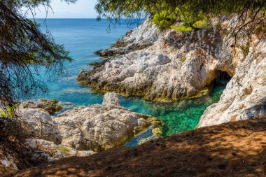 The famous turquoise Amarantos cape well known from the famous Mamma Mia musical movie, located in Skopelos island, Sporades, Greece