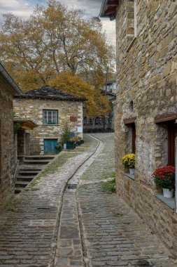 The picturesque village of Tsepelovo during fall season with its architectural traditional old stone  buildings, located on Tymfi mount, Zagori, Epirus, Greece, Europe