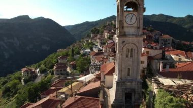 Aerial view of the historical village Dimitsana with the traditional houses and the famous clock tower in Arcadia, Peloponnese, Greece
