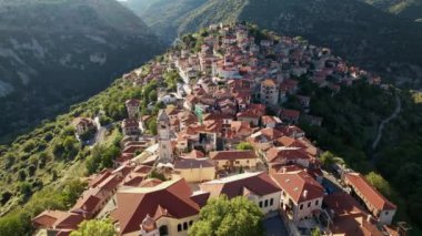 Aerial view of the historical village Dimitsana with the traditional houses and the famous clock tower in Arcadia, Peloponnese, Greece