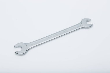 a single wrench on a white surface