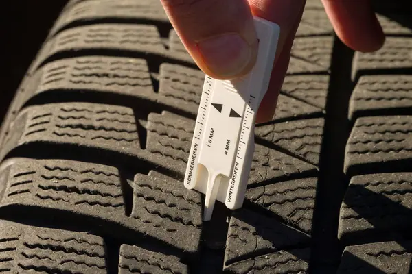 Close Measuring Tread Depth Car Tire Stock Photo