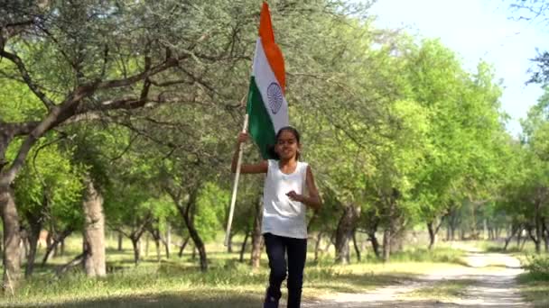 Cute Little Indian Girl Holding Waving Running Tricolour Hill Greenery — Stock Video