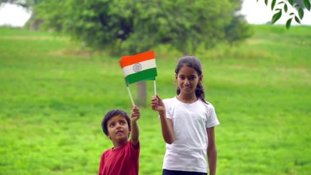 Cute Little Indian Kids Holding Waving Running Tricolour Greenery Background — Stock Video