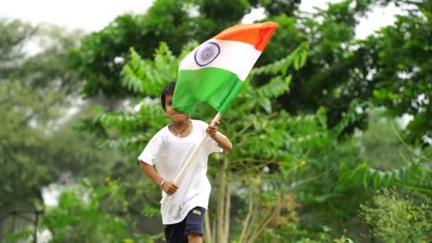 Cute Little Indian Kids Holding Waving Running Tricolour Greenery Background — Stock Video