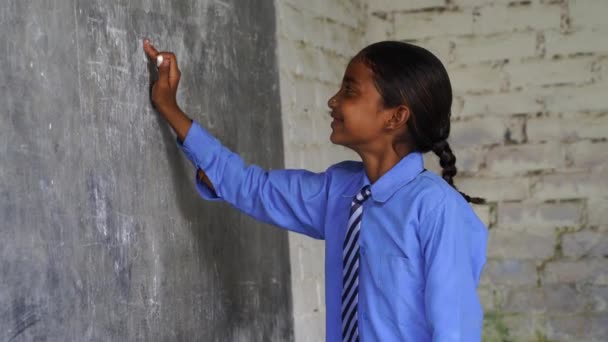 Happy Indian School Girl Child Standing Front Black Chalkboard Background — Stock Video