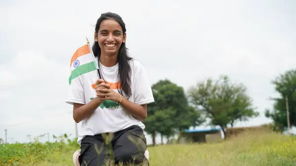 stock image Indian child celebrating Independence or Republic day, Cute little Indian child holding, waving or running with Tricolour flag. Har Ghar Tiranga