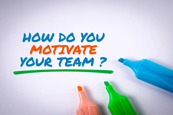 How Do You Motivate Your Team. Text and colored markers on a white background.
