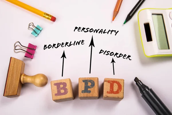 BPD - Borderline Personality Disorder. Wooden blocks on a white office table.