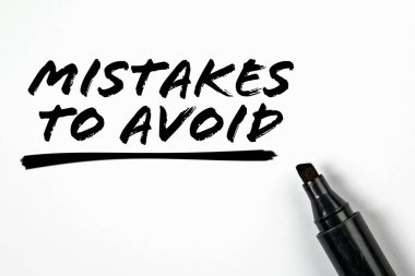 Mistakes To Avoid. Text and black marker on a white background. clipart