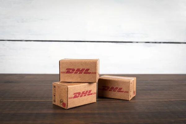 stock image Sigulda, Latvia - February 5, 2023: DHL cardboard packaging boxes in stack. Mail and parcel delivery