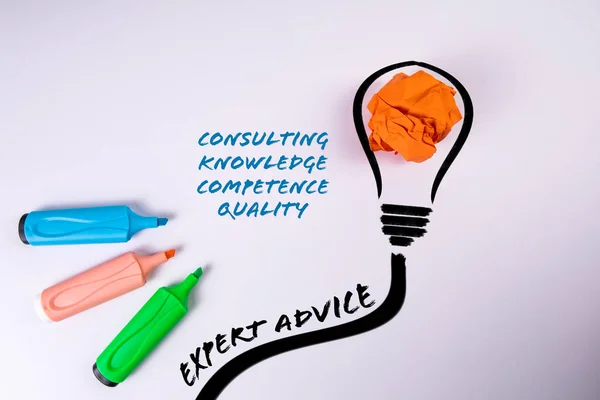 Expert Advice Concept. Colored markers and a crumpled sheet of paper on a white background.