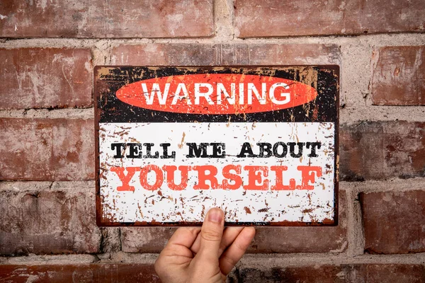 Tell Me About Yourself. Warning sign with text.