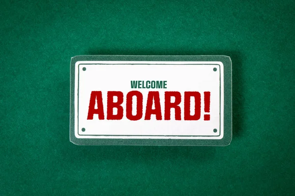 Welcome Aboard. Sticky note with text on a green background.