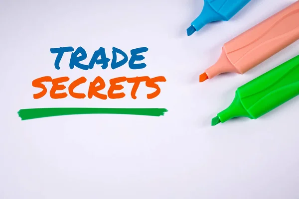 TRADE SECRETS. Text and colored markers on a white background.