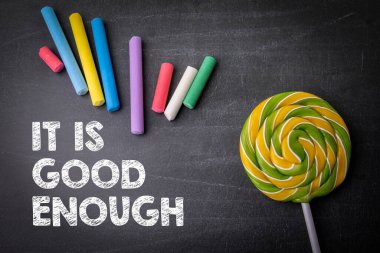 It is good enough. Colored pieces of chalk on a dark chalkboard background. clipart