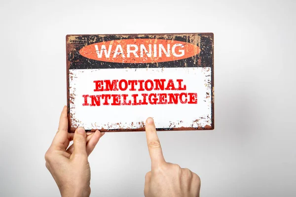 Emotional Intelligence. Warning sign with text on a white background.