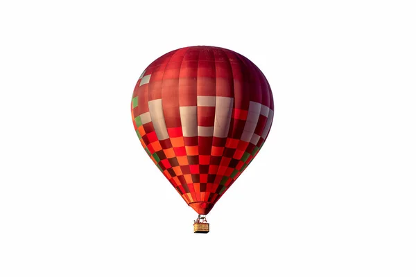 Red hot air balloon with basket isolated on white background.