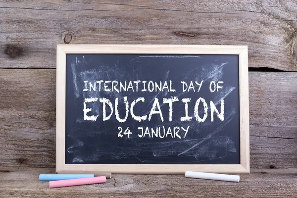 International Day of Education. Text on a chalkboard background.