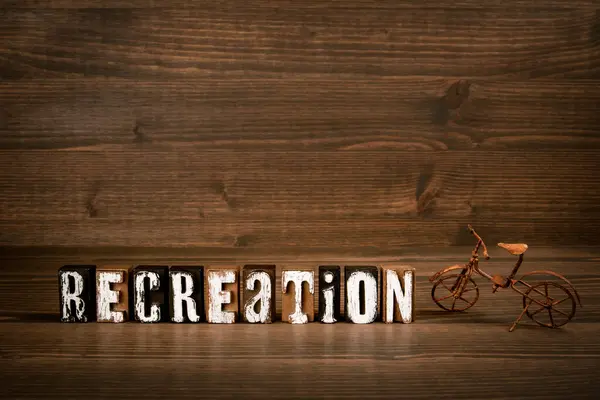 Recreation Text Alphabet Blocks Rusty Miniature Bicycle Wood Texture Background — Foto Stock