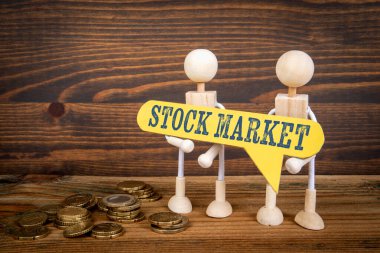 Borsa Konsepti. Yazılı sarı konuşma balonu. Minyatür insan figürü.