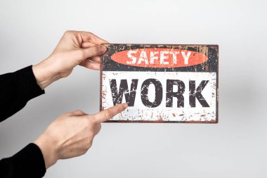 WORK SAFETY Concept. Sign with text in hand on white background. clipart