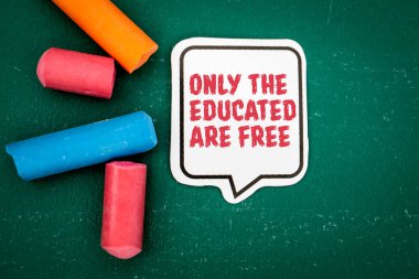 Only the educated are free. Speech bubble on a green chalkboard. clipart