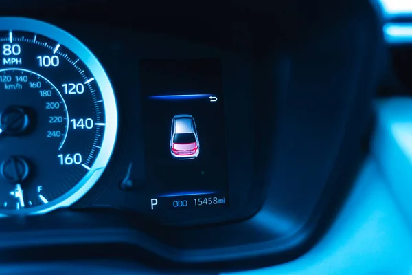 Open trunk dashboard warning lights with LED odometer and speedometer, illuminated boot lid symbol. Close and open door notification on monitor system near steering wheel of modern auto vehicle