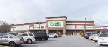 NOV 16, 2022-FLOWERY BRANCH, GA, US:Panorama view Publix Food  Pharmacy at faade entrance of employee-owned American supermarket chain private corporation headquartered in Lakeland, Florida, America